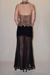 Rear studio linesheet view displaying the back of the leopard print Felicia halter top, highlighting the completely open back and high buttoned halter collar.