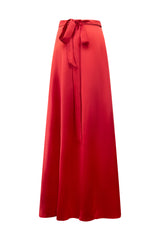 Studio product shot of the back of the vibrant red Marysol Silk Wrap Skirt, highlighting the elegant waist tie bow and smooth silk draping.