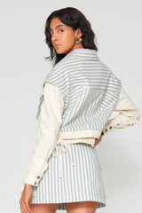 Back view of matching striped jacket and Mati Denim Skirt showcasing coordinated blue stripe design and contemporary tailoring.