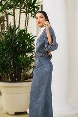 Side view of Andrea high waisted wide leg denim pants styled with lace blouse, statement belt, and tailored silhouette.