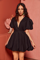 Front view of the Cameron black bubble mini dress highlighting deep V-neckline, puff sleeves, side cutouts, and bubble hem silhouette.