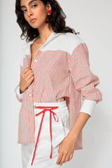 Woman wearing Cindy Castro New York in a striped red and white shirt 