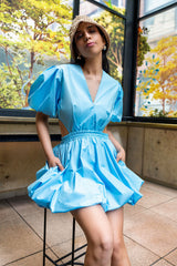 Close-up of the Cameron blue bubble mini dress highlighting puff sleeves, deep V-neckline, gathered waist, and bubble hem silhouette.