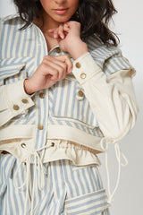 Close-up view of the Giani striped denim jacket highlighting the cream canvas buttoned cuffs and contrast yellow topstitching.