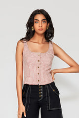 Close-up studio shot of a model wearing the red and white Ines Striped Bustier Top, highlighting its structured corset design and button-front detailing.